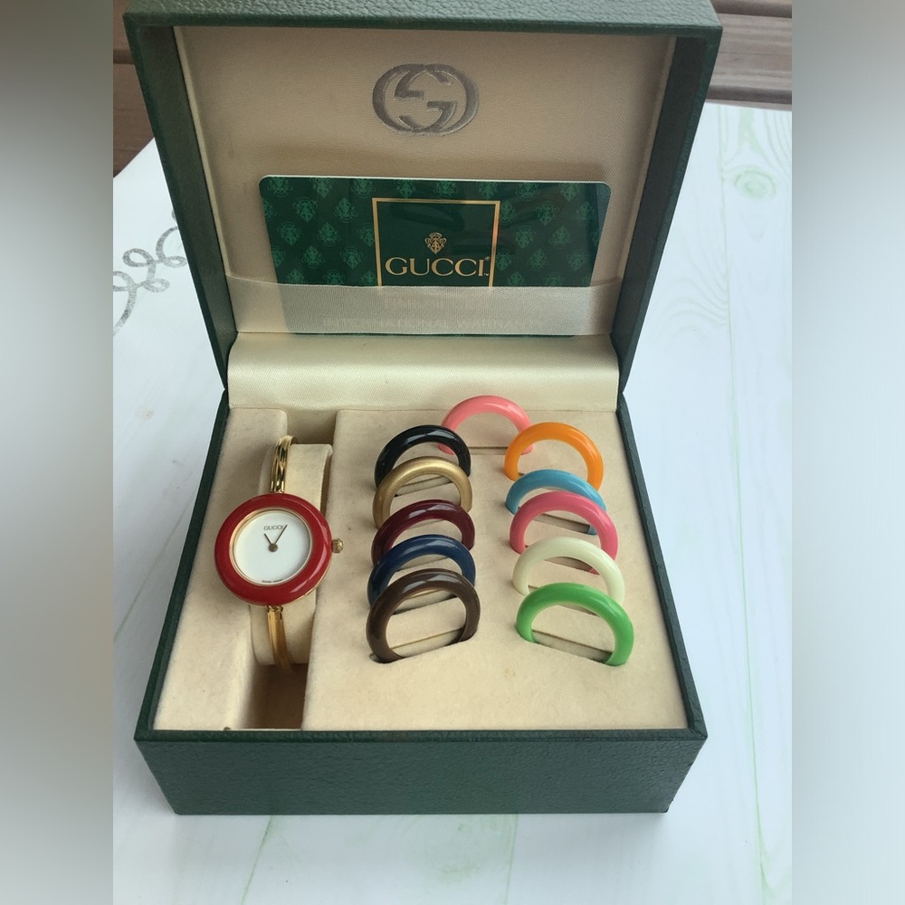 Gucci Women’s Gold Bangle Watch with Interchangeable Color Bezels